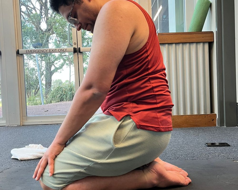 Injured athlete using stationary bike as part of active rest rehab program